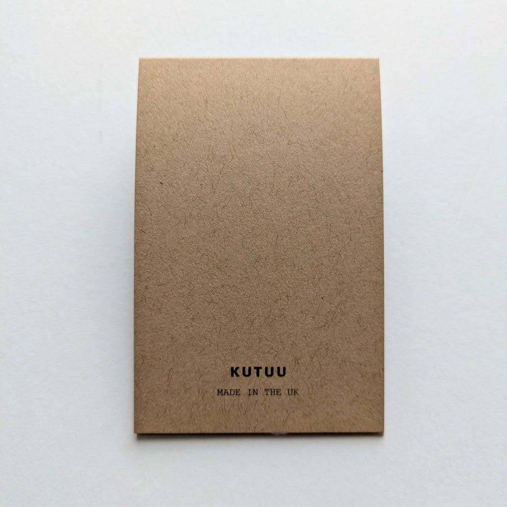 Kraft paper rear of card packaging with 'KUTUU' branding on a white background