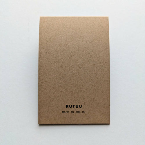 Kraft paper rear of card packaging with 'KUTUU' branding on a white background