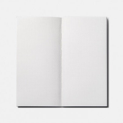 Open notebook with dot grid pages on a white background