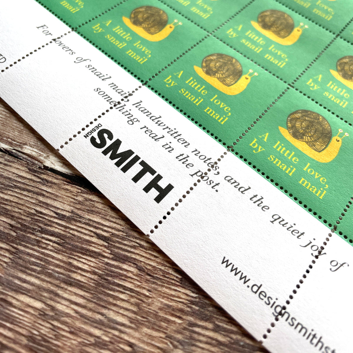 Packaging of Design Smith products on a wooden surface