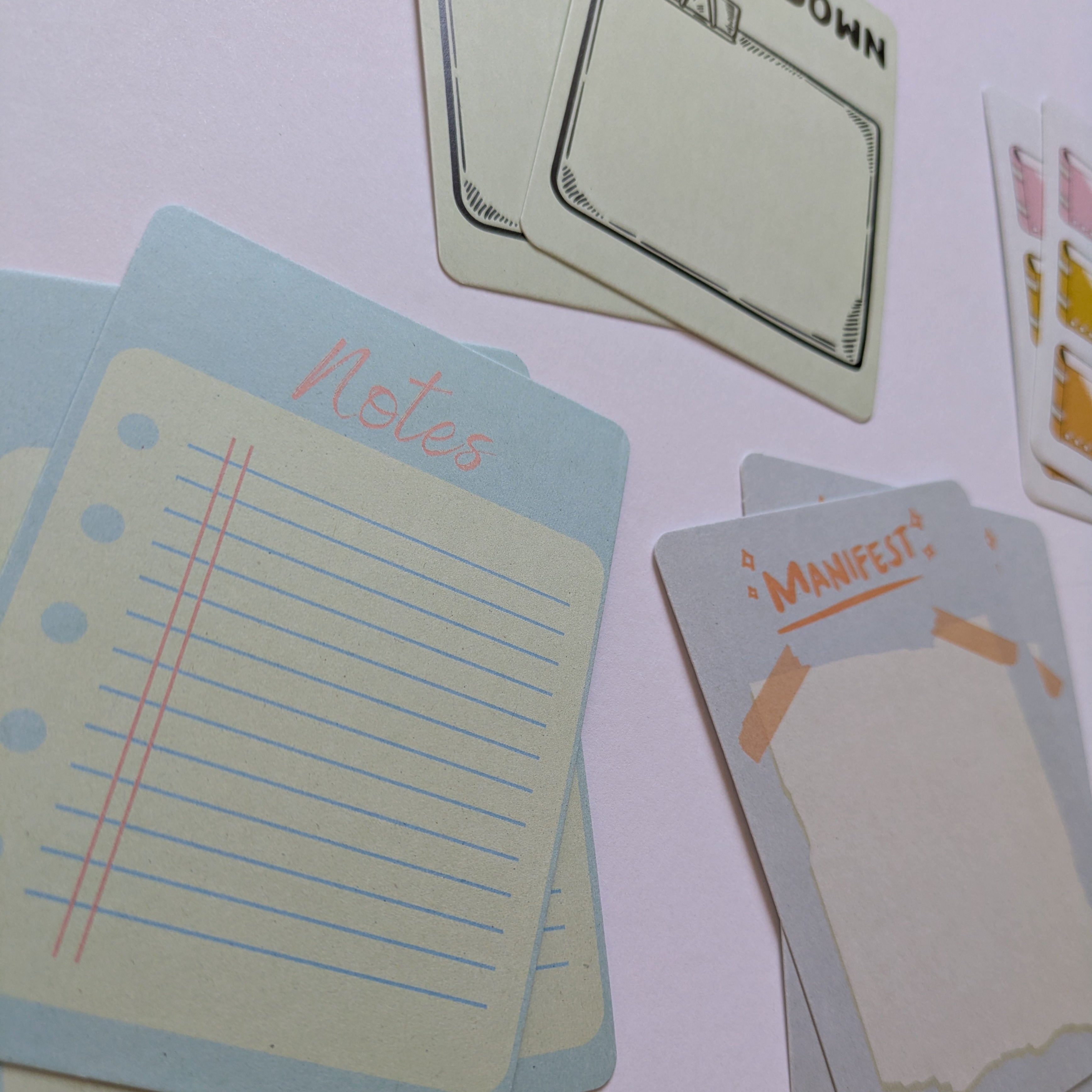 Set of index cards with various designs on a white background