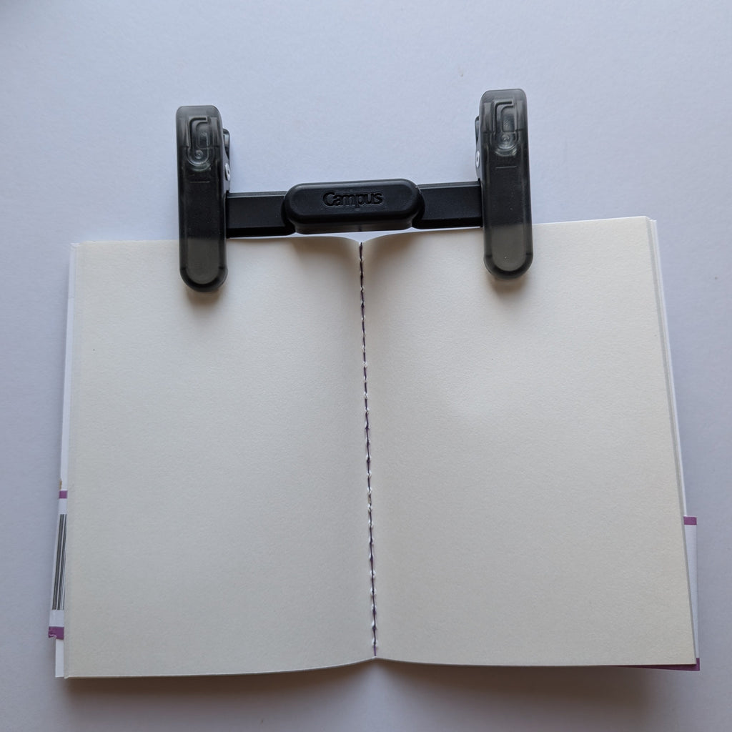 Black Campus KOKUYO blip holding a notebook 
