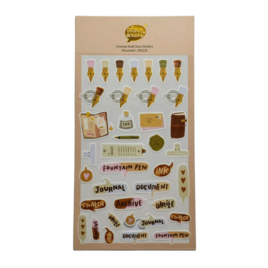 A sheet of cute desk-themed stickers on a beige backing card, displayed against a neutral light gray background. The stickers feature illustrations of fountain pens, notebooks, stamps, and text labels like 'Fountain Pen', 'Journal', and 'Document'.