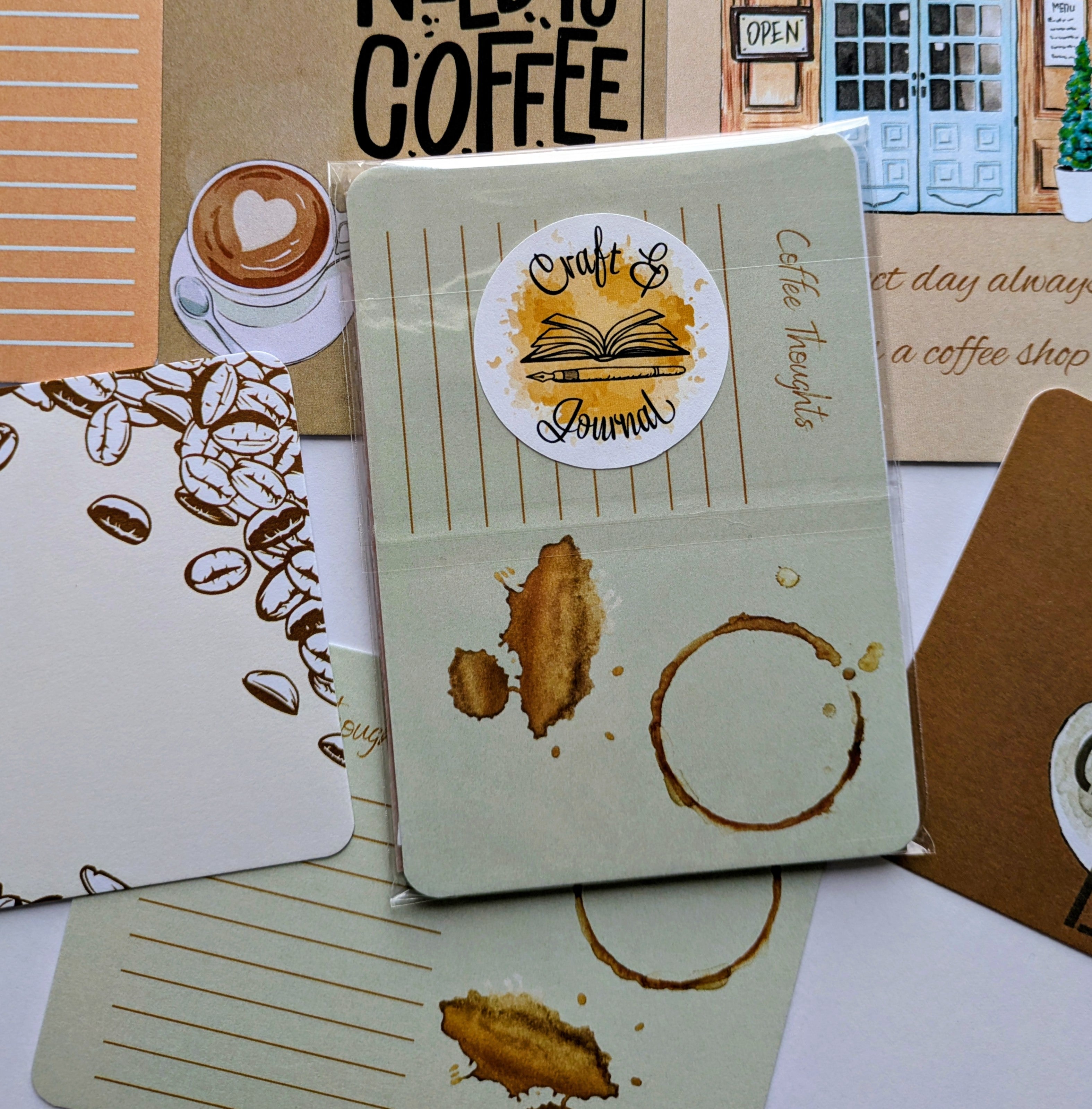 Craft journal with coffee-themed design on a surface with coffee-themed items.