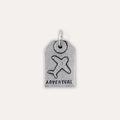 A silver-toned luggage tag charm featuring an embossed airplane and the word 'ADVENTURE' at the bottom, shown on a plain light beige background.