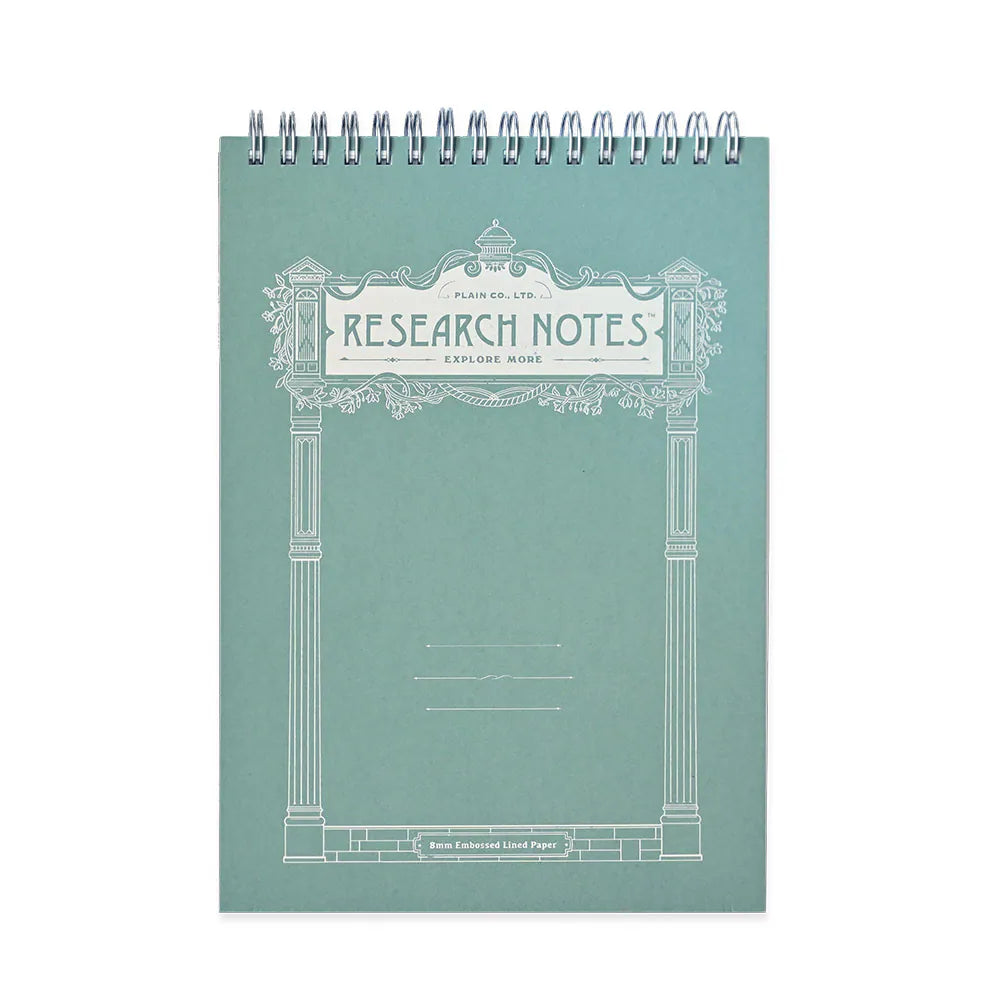 A mint green spiral-bound notebook titled 'RESEARCH NOTES' with a white classical column border design on the cover, photographed against a plain white background.