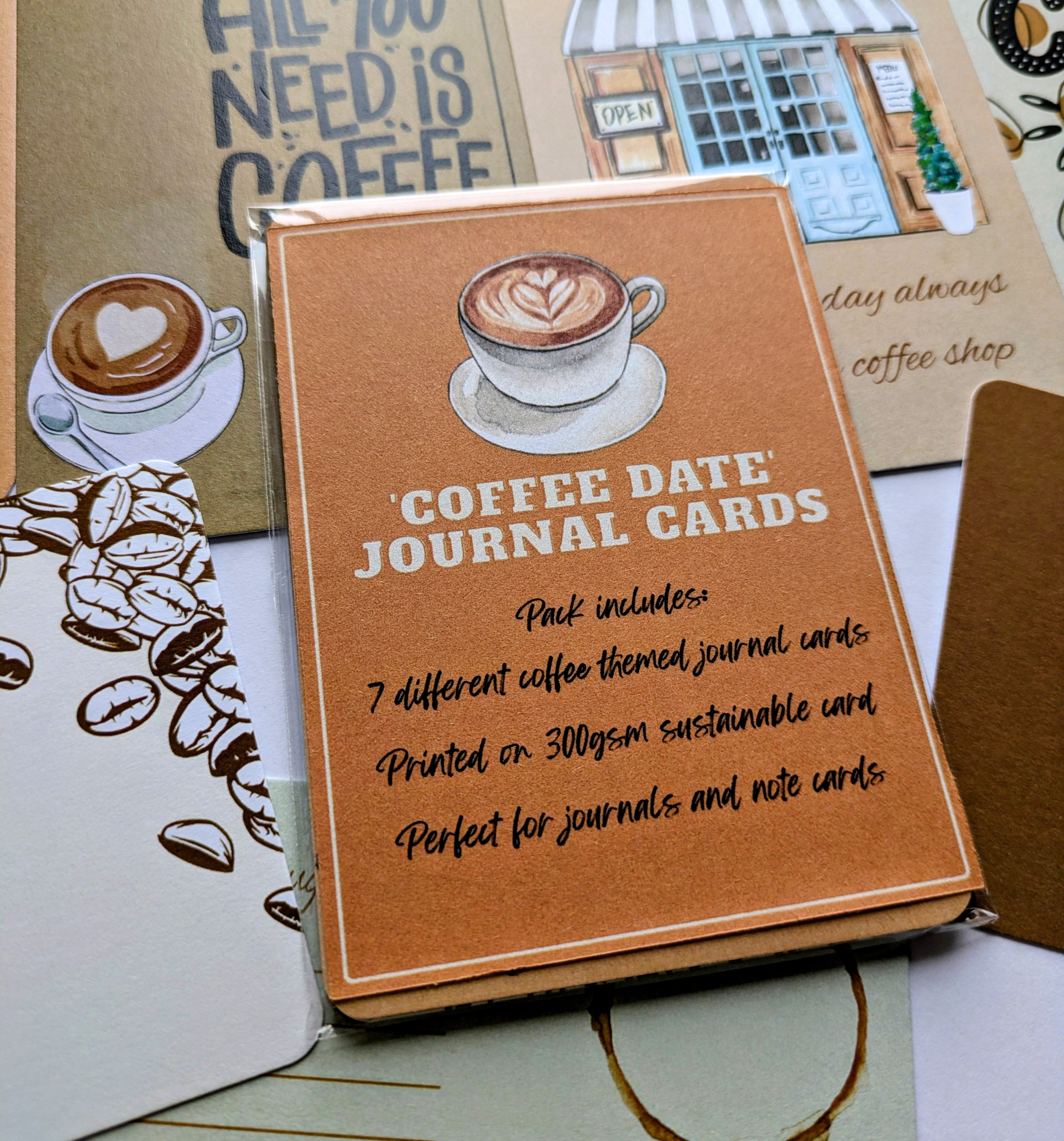Coffee-themed journal cards with a cup of coffee illustration on a textured surface.
