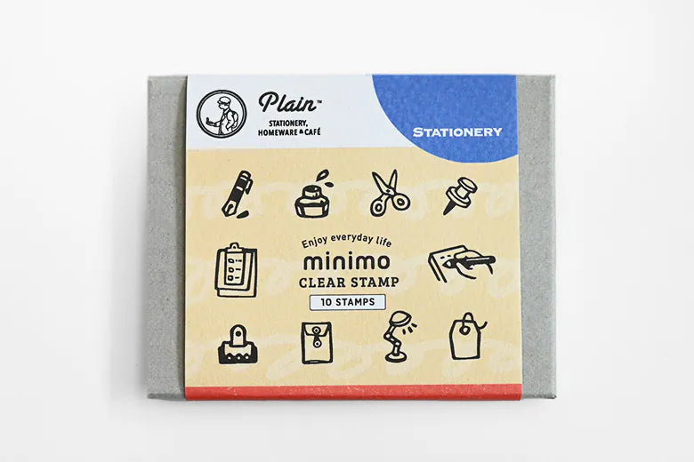 A pack of 10 clear stamps from Plain Stationery, presented in a gray cardboard sleeve with a beige and blue illustrated cover, photographed on a clean white background.