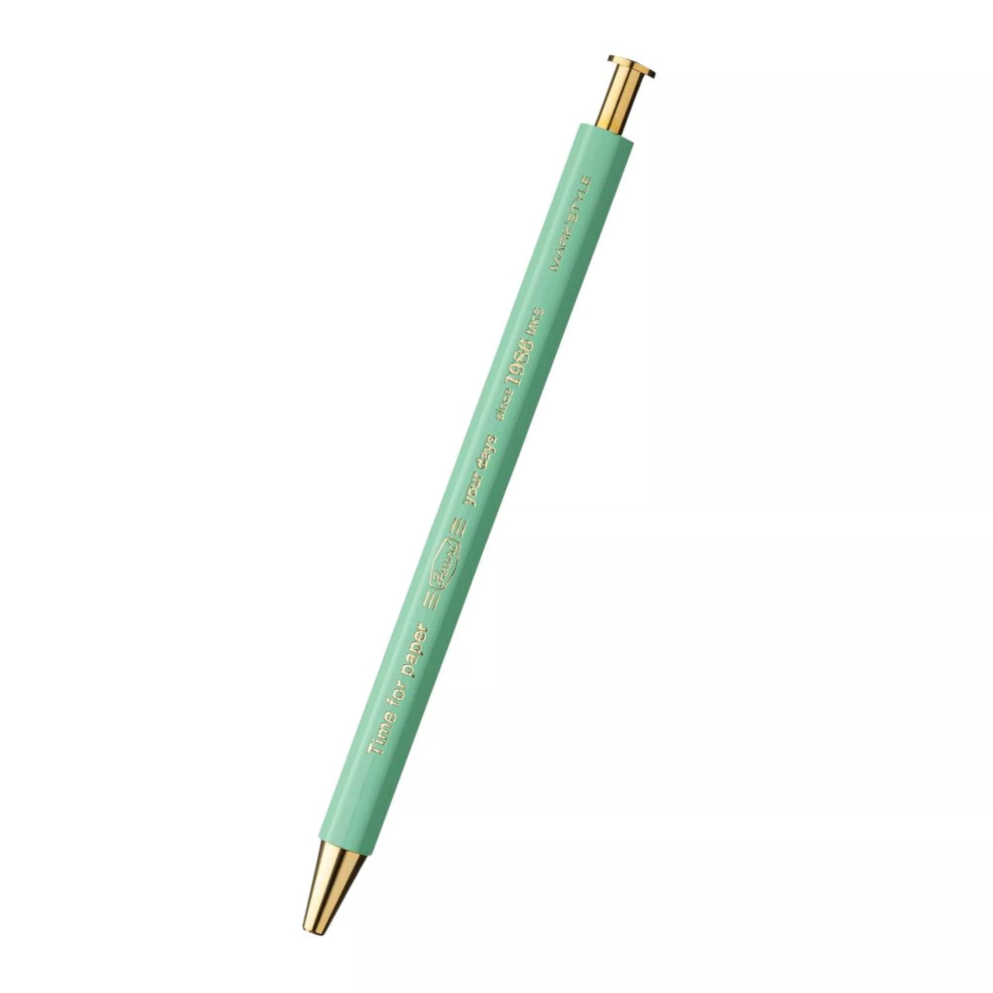 Mint green pen with gold accents on a white background