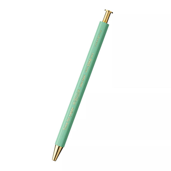 Mint green pen with gold accents on a white background