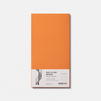 Orange notebook with a label on a white background