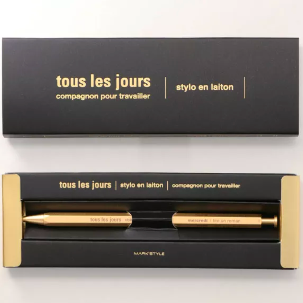 Black and gold pen set with packaging on a white background
