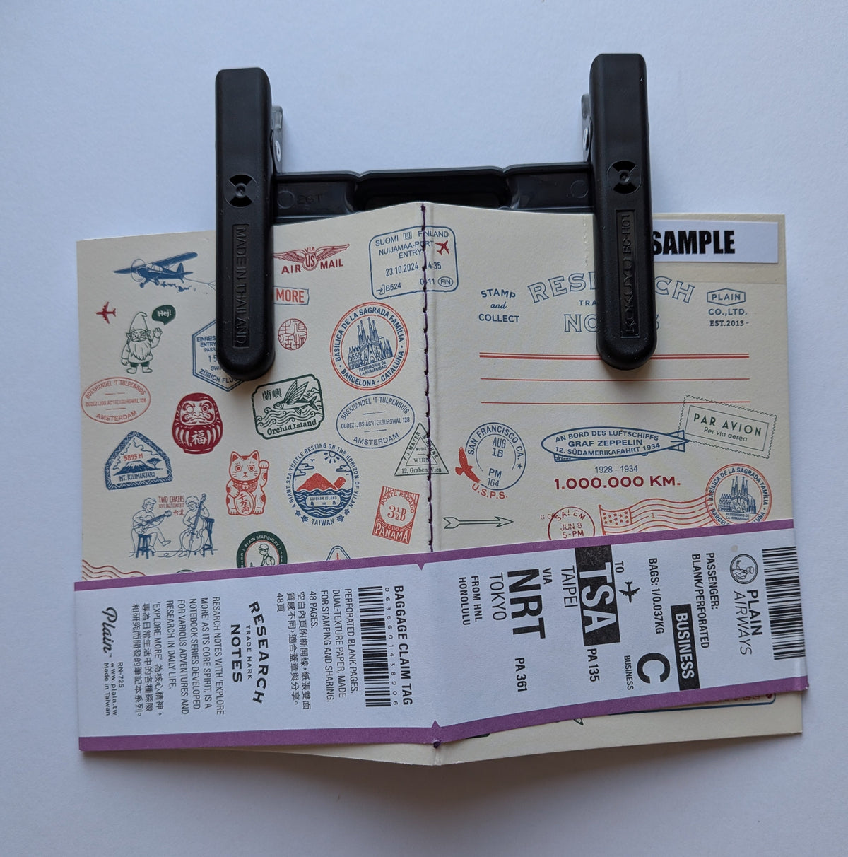 Campus KOKUYO clip holding a notebook