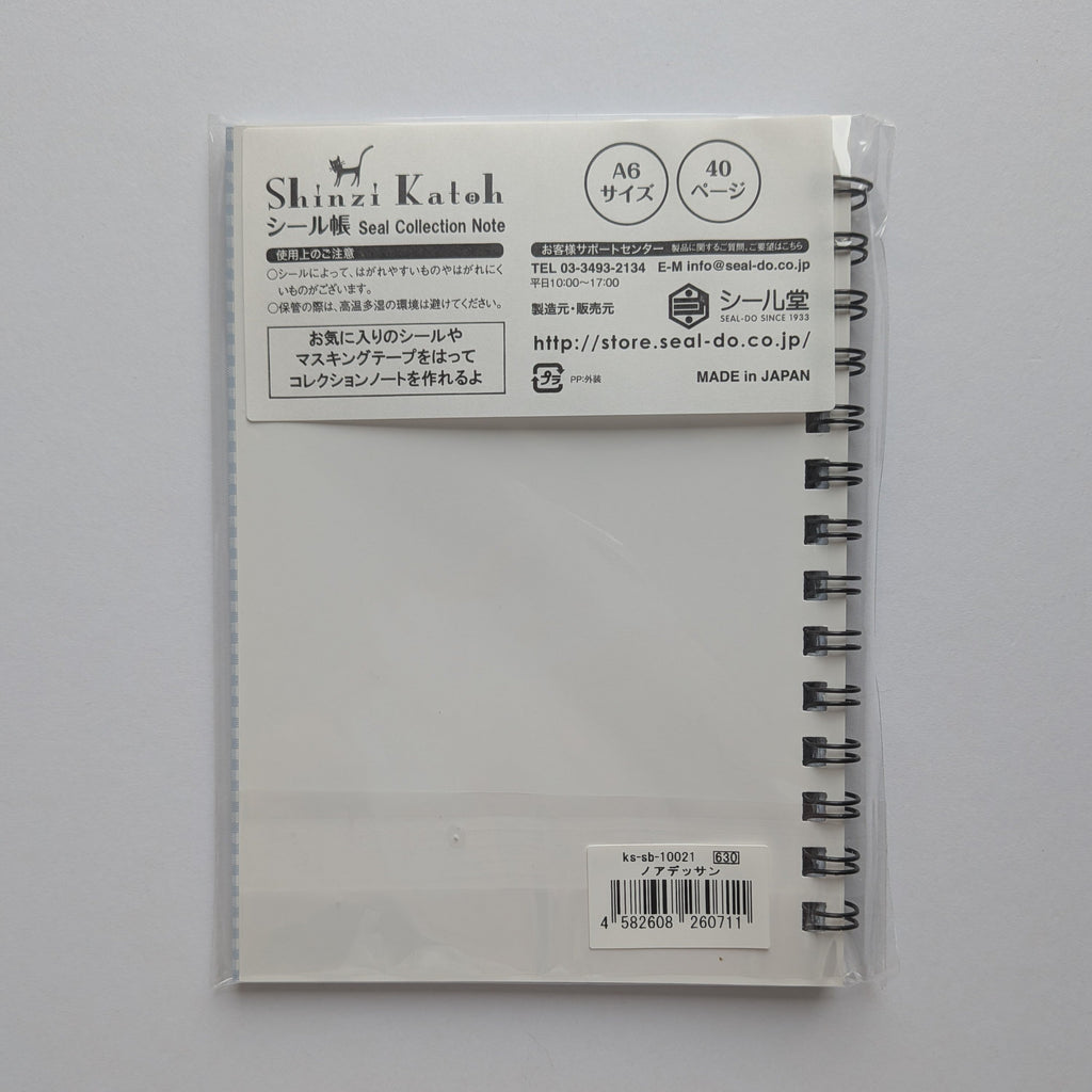 Shinzi Katoh Seiltsu Collection Note A6 size 40-page spiral notebook in clear plastic packaging, shown against a light gray background.