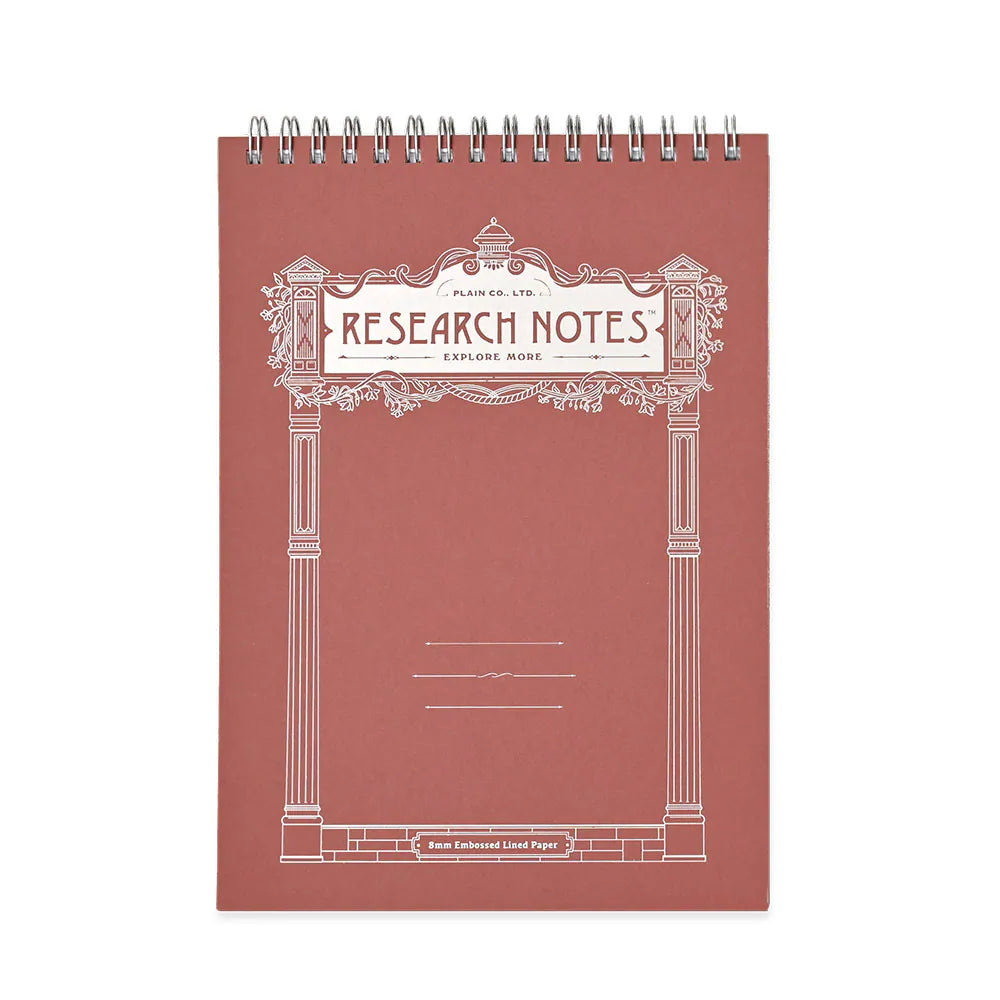 A spiral-bound notebook titled 'RESEARCH NOTES' with an ornate white decorative border on a dusty rose cover, shown against a plain white background.