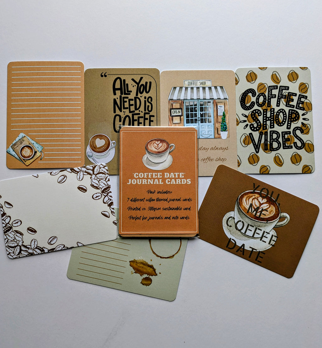 Collection of coffee-themed cards and stationery items on a white background