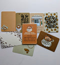 Collection of coffee-themed cards and stationery items on a white background