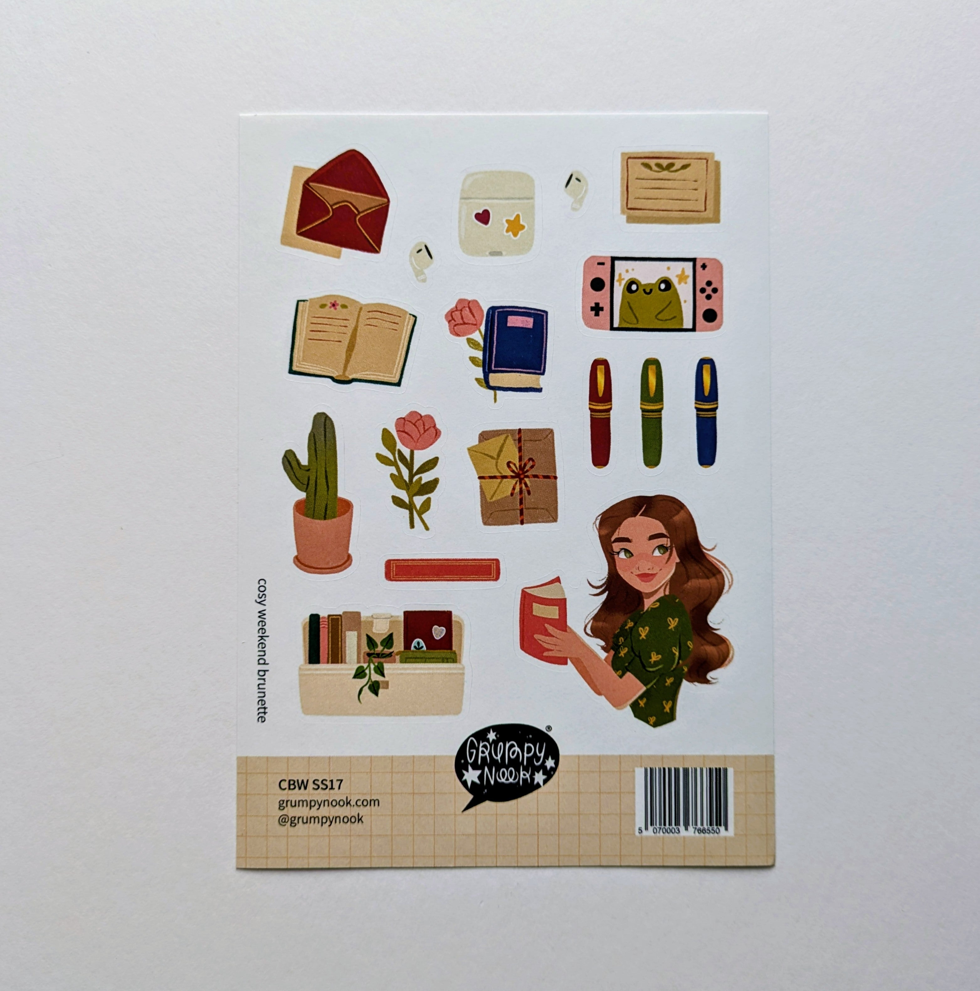 Sticker sheet with various illustrations including a woman reading a book, plants, and stationery items on a white background.