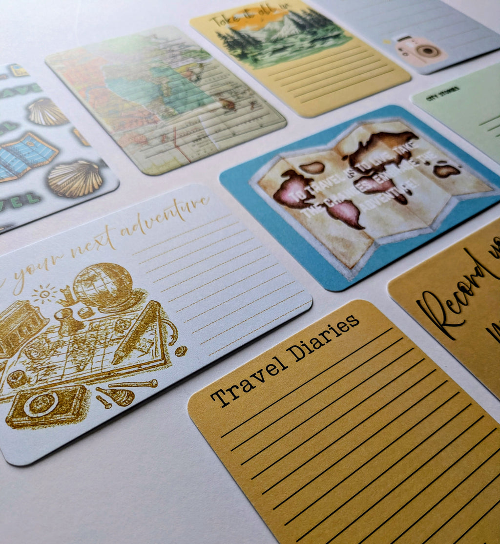 Collection of travel-themed cards and notes on a light background
