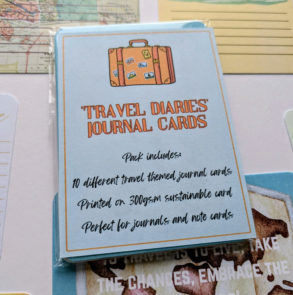 Pack of 'Travel Diaries' journal cards with a suitcase illustration on a map background.